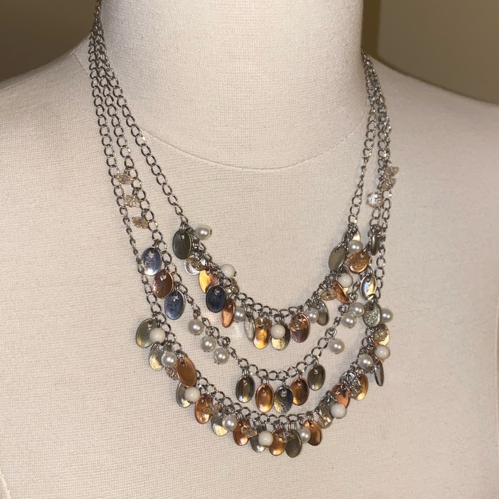 Draped necklace with mixed metal design